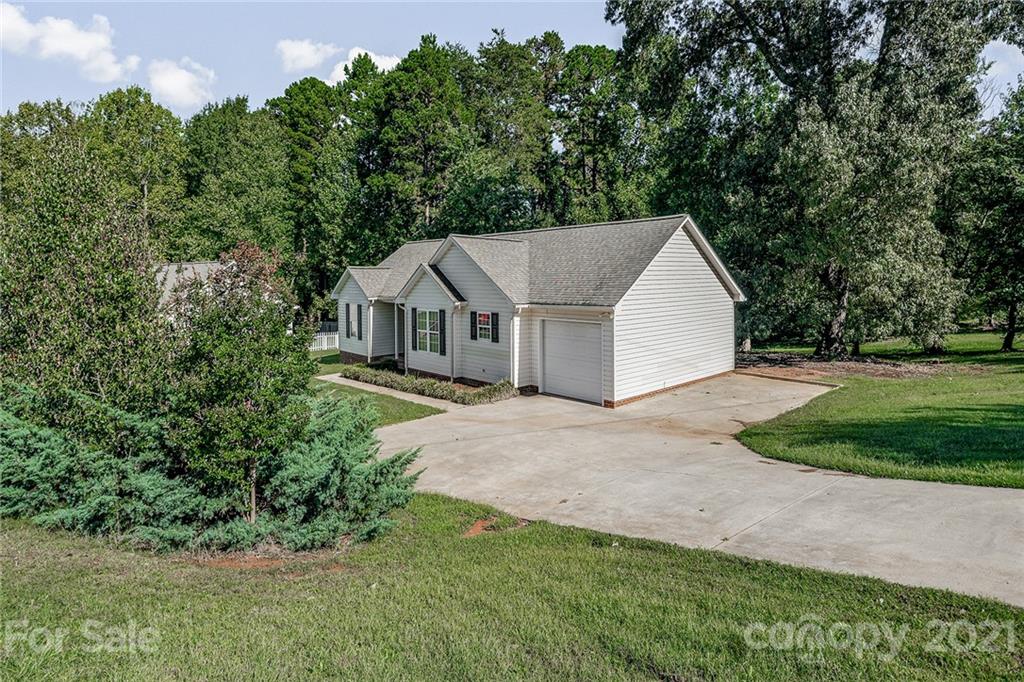 8577 Unity Church Road Denver, NC 28037 - Photo 3 of 33 a view of a house with a yard