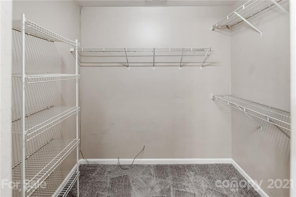 8577 Unity Church Road Denver, NC 28037 - Photo 22 of 33 a view of a room with racks on the wall