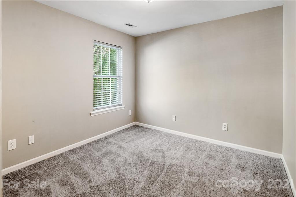 8577 Unity Church Road Denver, NC 28037 - Photo 24 of 33 a view of an empty room with a window