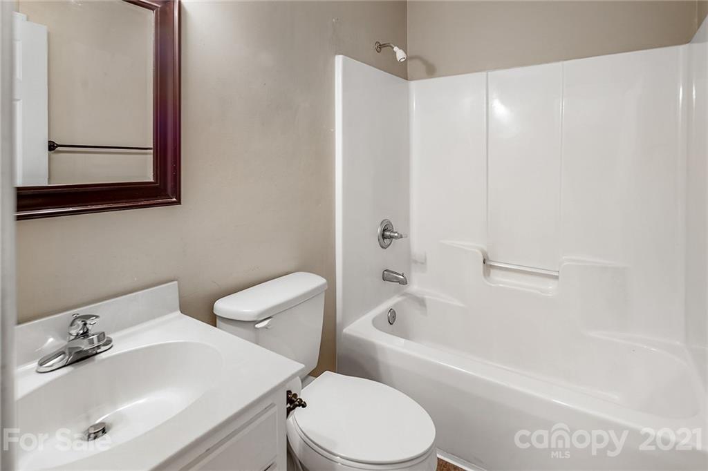 8577 Unity Church Road Denver, NC 28037 - Photo 25 of 33 a bathroom with a sink toilet and shower
