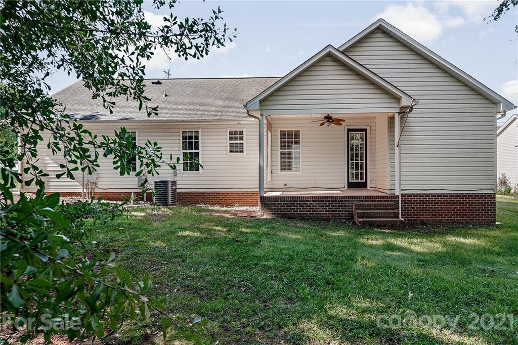 8577 Unity Church Road Denver, NC 28037 - Photo 27 of 33 a view of a house with a backyard