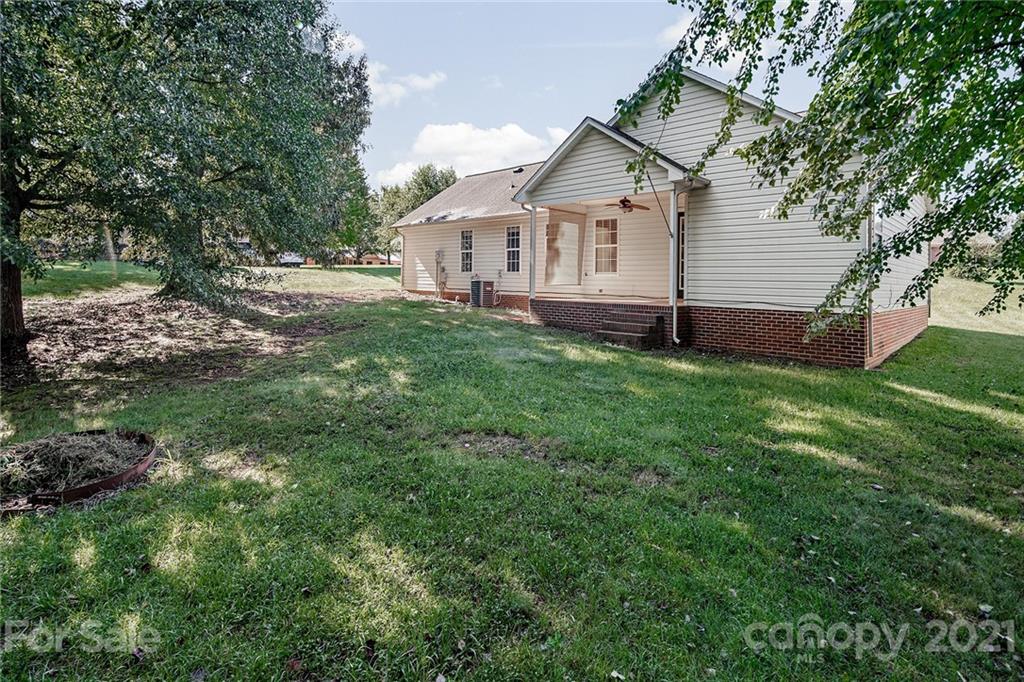 8577 Unity Church Road Denver, NC 28037 - Photo 28 of 33 a view of a house with a backyard