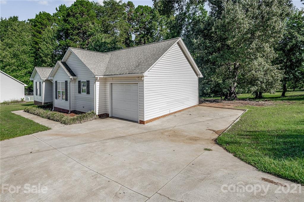8577 Unity Church Road Denver, NC 28037 - Photo 4 of 33 a view of a house with a yard