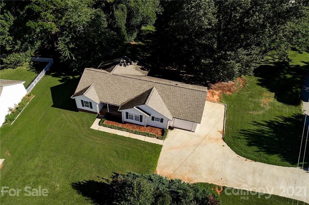 8577 Unity Church Road Denver, NC 28037 - Photo 32 of 33 an aerial view of a house with a garden and swimming pool