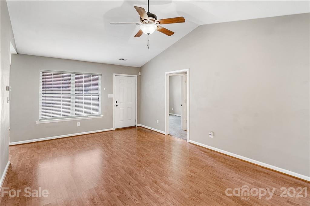 8577 Unity Church Road Denver, NC 28037 - Photo 7 of 33 wooden floor in an empty room with a window