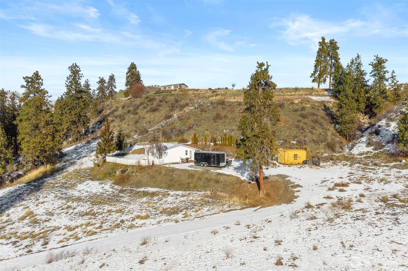 55 Swanson Gulch Road Manson, WA 98831 - Photo 3 of 19 a view of a dry yard with trees