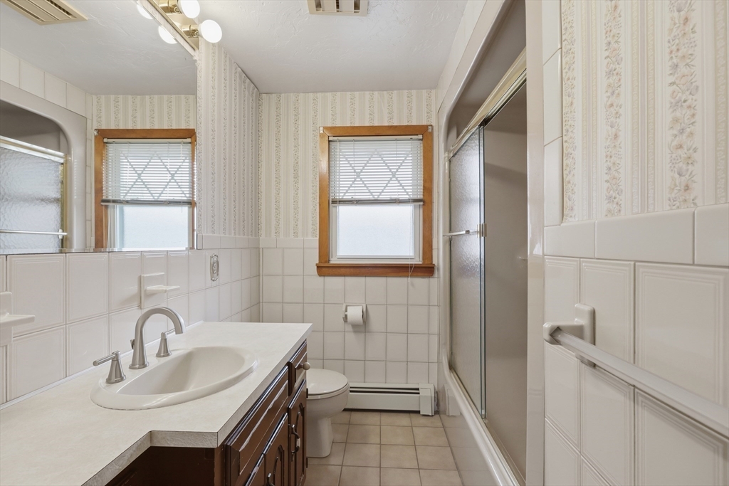 10 Deluca Road Milford, MA 01757 - Photo 24 of 37 a bathroom with a sink a toilet and shower