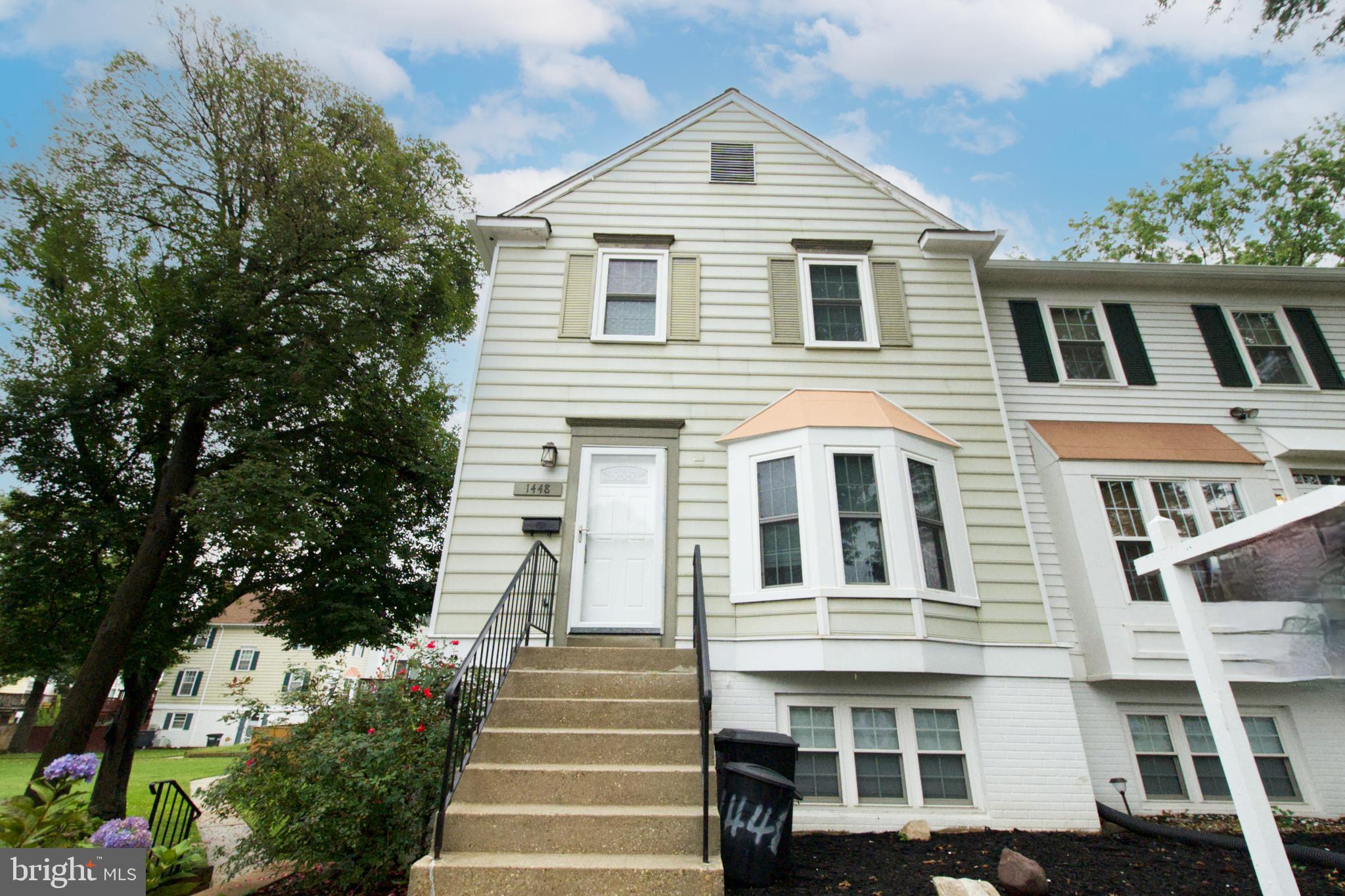 1448 Orleans Court Crofton, MD 21114 - Photo 3 of 32 a front view of a house with a yard