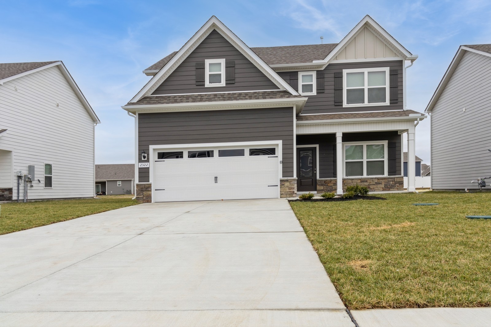 front view of a house with a yard