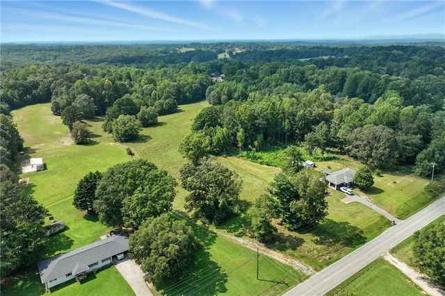 a view of a garden with a building in the background