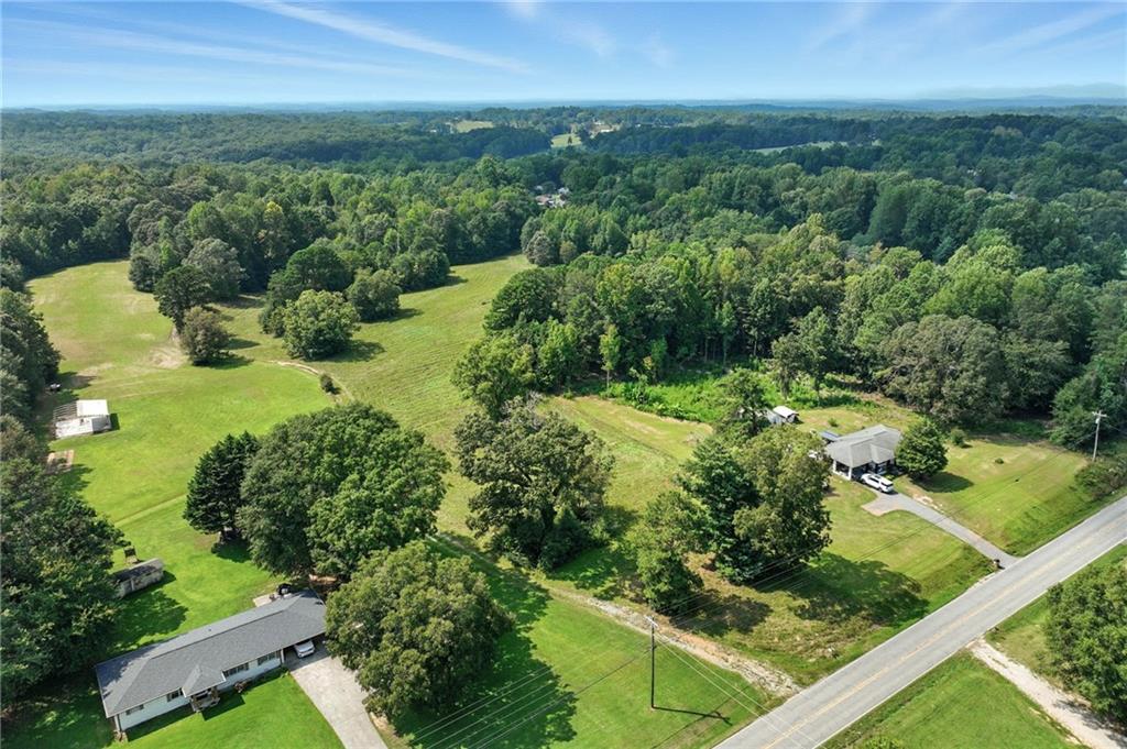 4363 Sardis Road Gainesville, GA 30506 - Photo 2 of 30 a view of a garden with a building in the background
