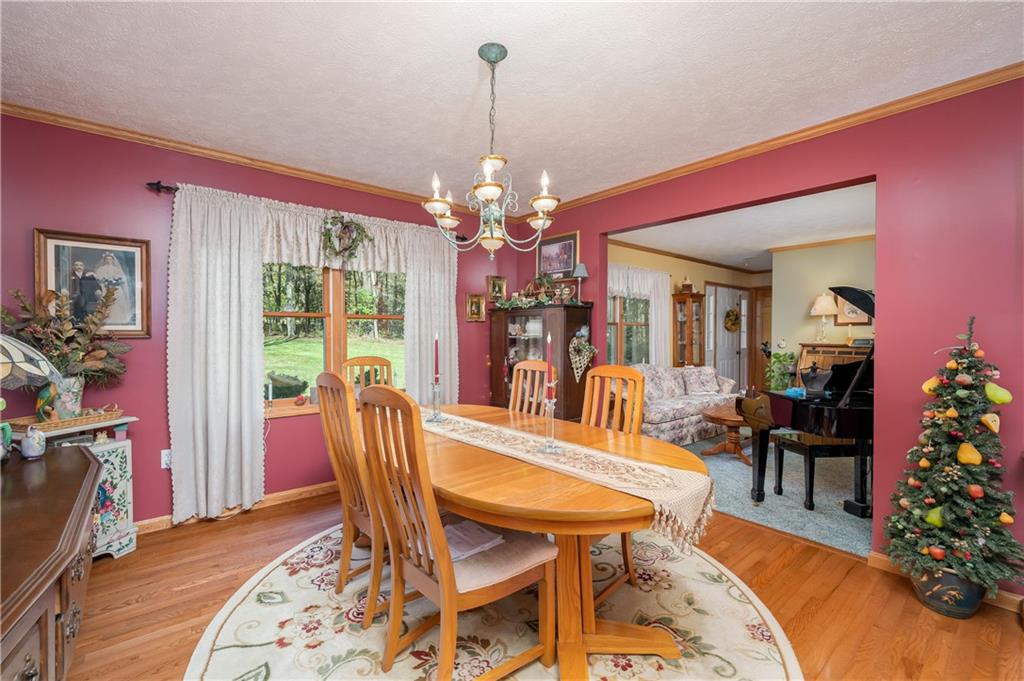 360 Sopher Road Grove City, PA 16127 - Photo 11 of 25 a view of a dining room with furniture and chandelier