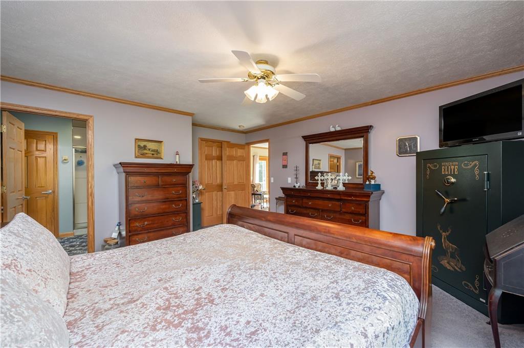 360 Sopher Road Grove City, PA 16127 - Photo 14 of 25 a bedroom with a bed and a flat screen tv