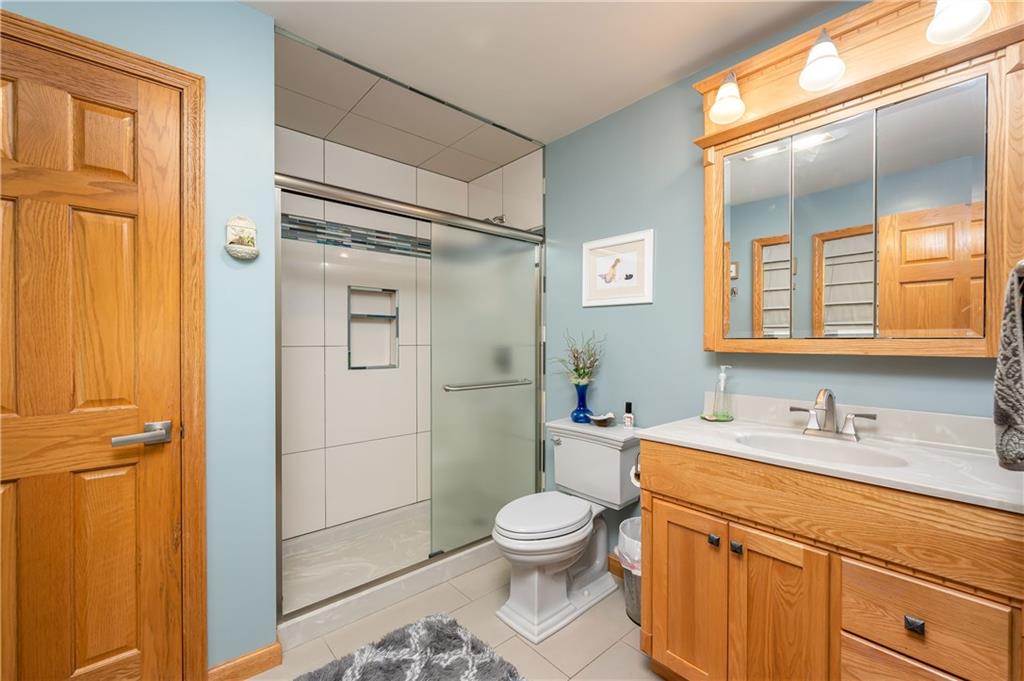 360 Sopher Road Grove City, PA 16127 - Photo 15 of 25 a bathroom with a granite countertop toilet sink and shower
