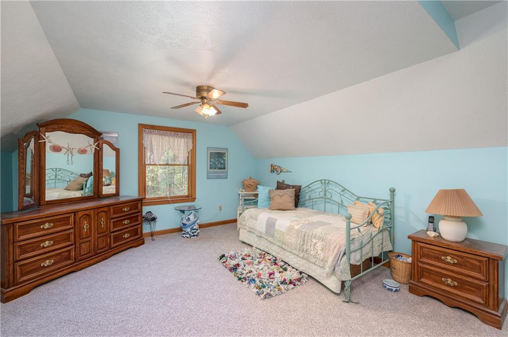 360 Sopher Road Grove City, PA 16127 - Photo 16 of 25 a bedroom with a bed and a dresser