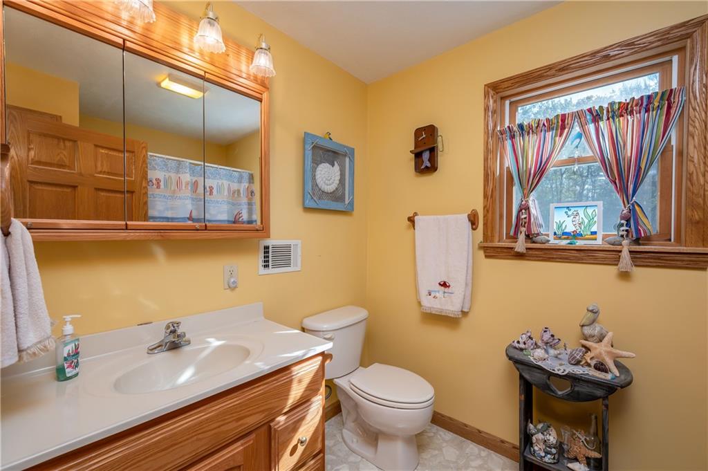 360 Sopher Road Grove City, PA 16127 - Photo 17 of 25 a bathroom with a sink mirror and toilet