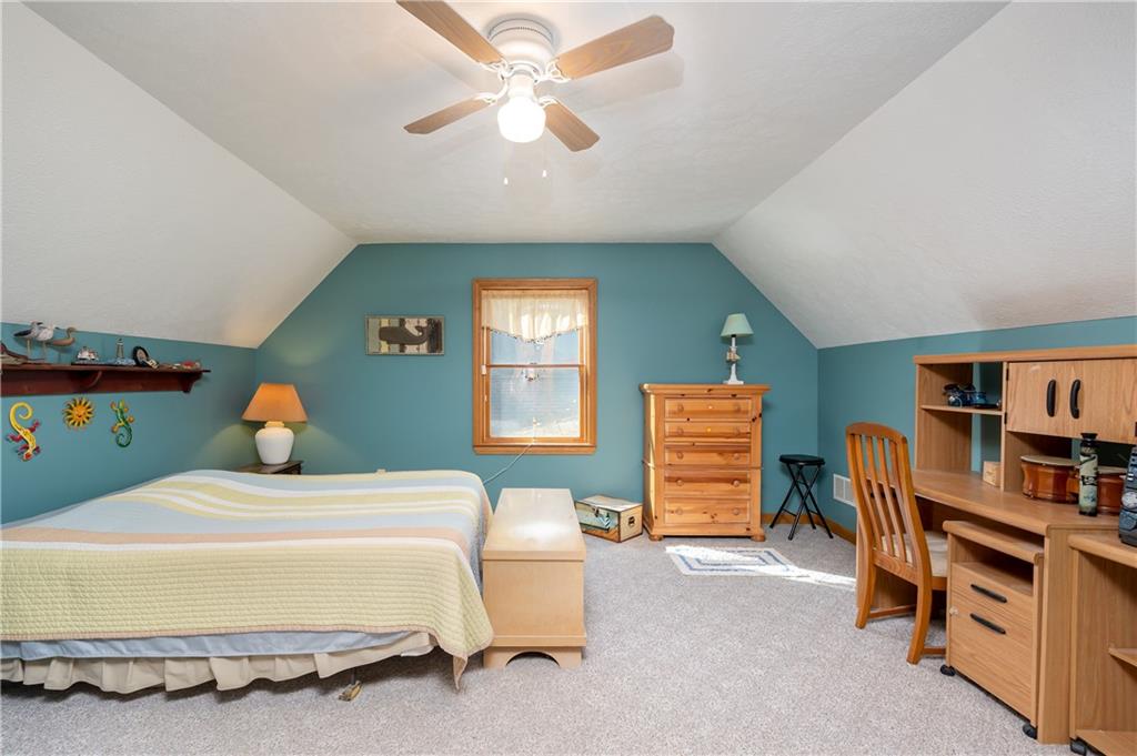 360 Sopher Road Grove City, PA 16127 - Photo 19 of 25 a bedroom with a bed and a chandelier