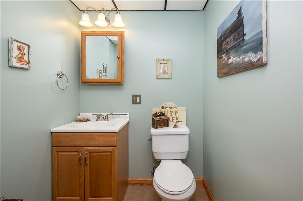 360 Sopher Road Grove City, PA 16127 - Photo 22 of 25 a bathroom with a toilet sink vanity and mirror
