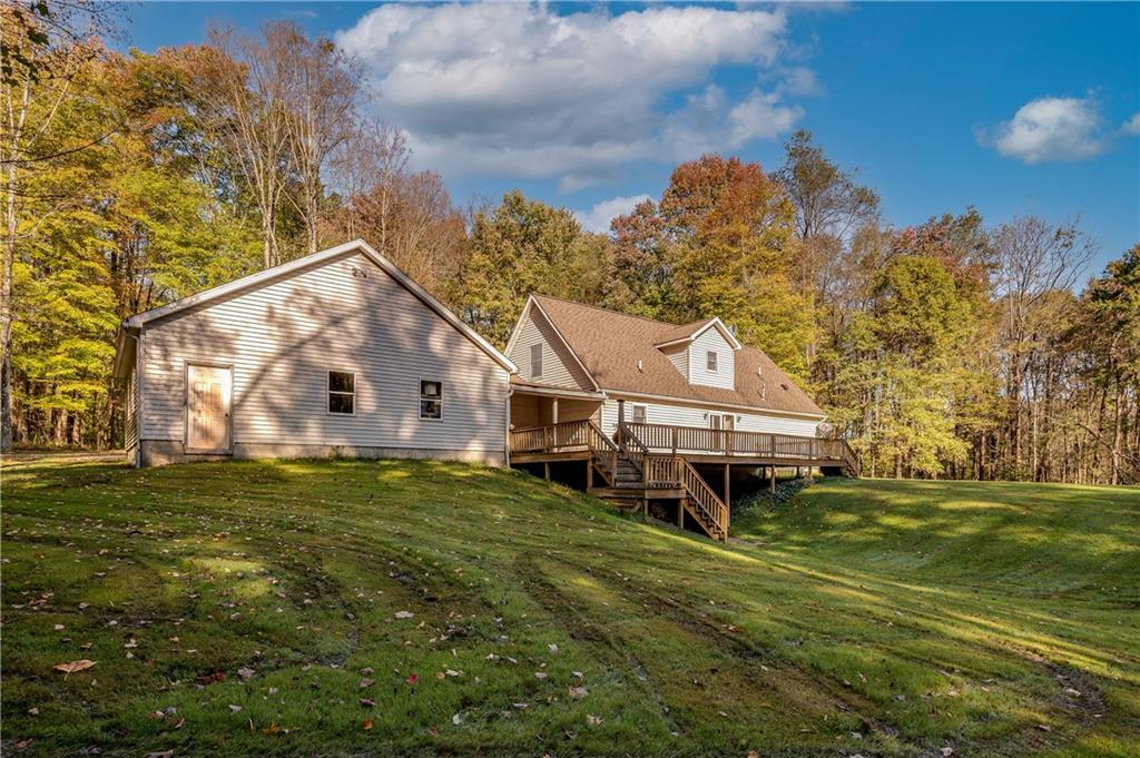 360 Sopher Road Grove City, PA 16127 - Photo 23 of 25 a house that is sitting in the grass with large trees