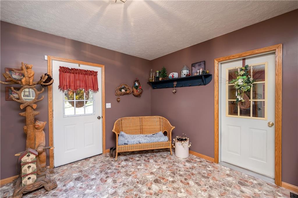 360 Sopher Road Grove City, PA 16127 - Photo 4 of 25 a room with furniture and a window