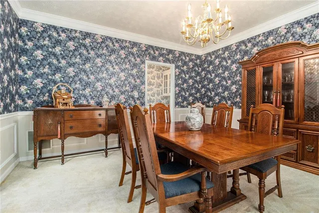 a view of a bathroom with a sink and refrigerator