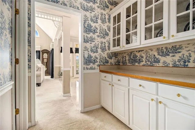 a spacious bedroom with a bed and a couch