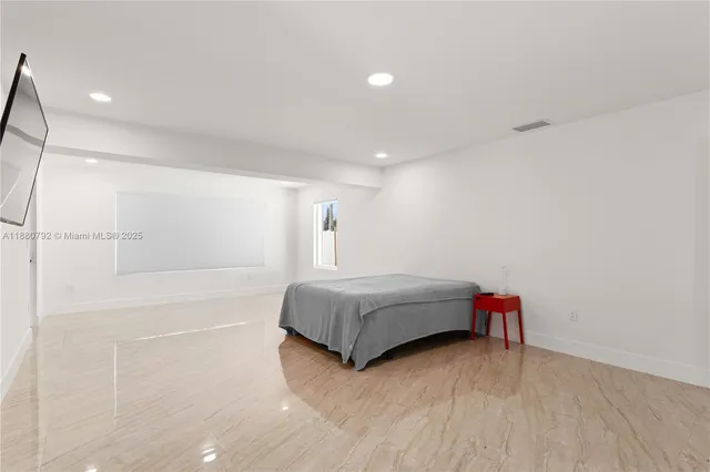 a bathroom with a tub and shower