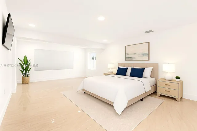 a bedroom with a bed and a painting on the wall