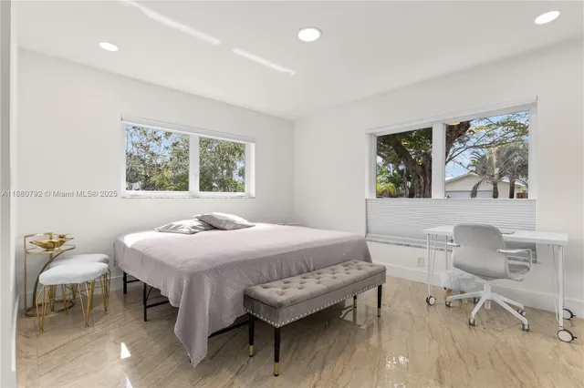 a bedroom with a bed and a table in it