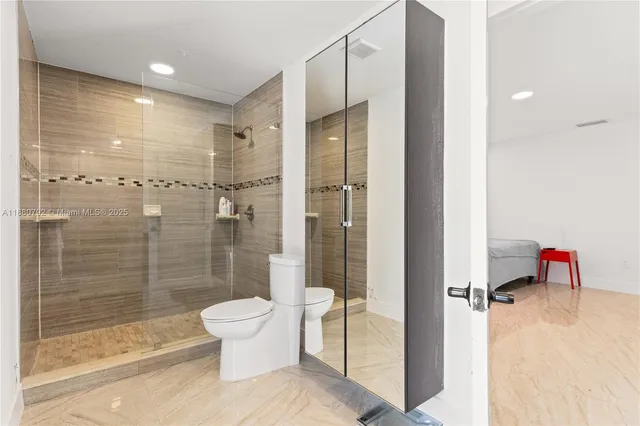 a bathroom with a shower and a toilet