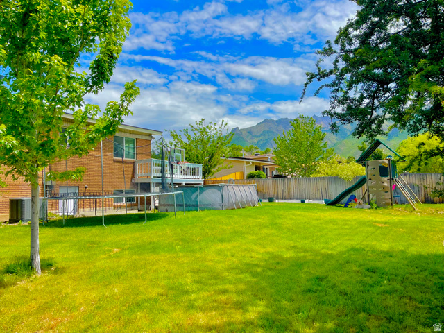 2444 Quail Run Drive Sandy, UT 84093 - Photo 17 of 23 Expansive backyard featuring, above ground pool, play/swing set. Garden boxes and back entrance to lower level
