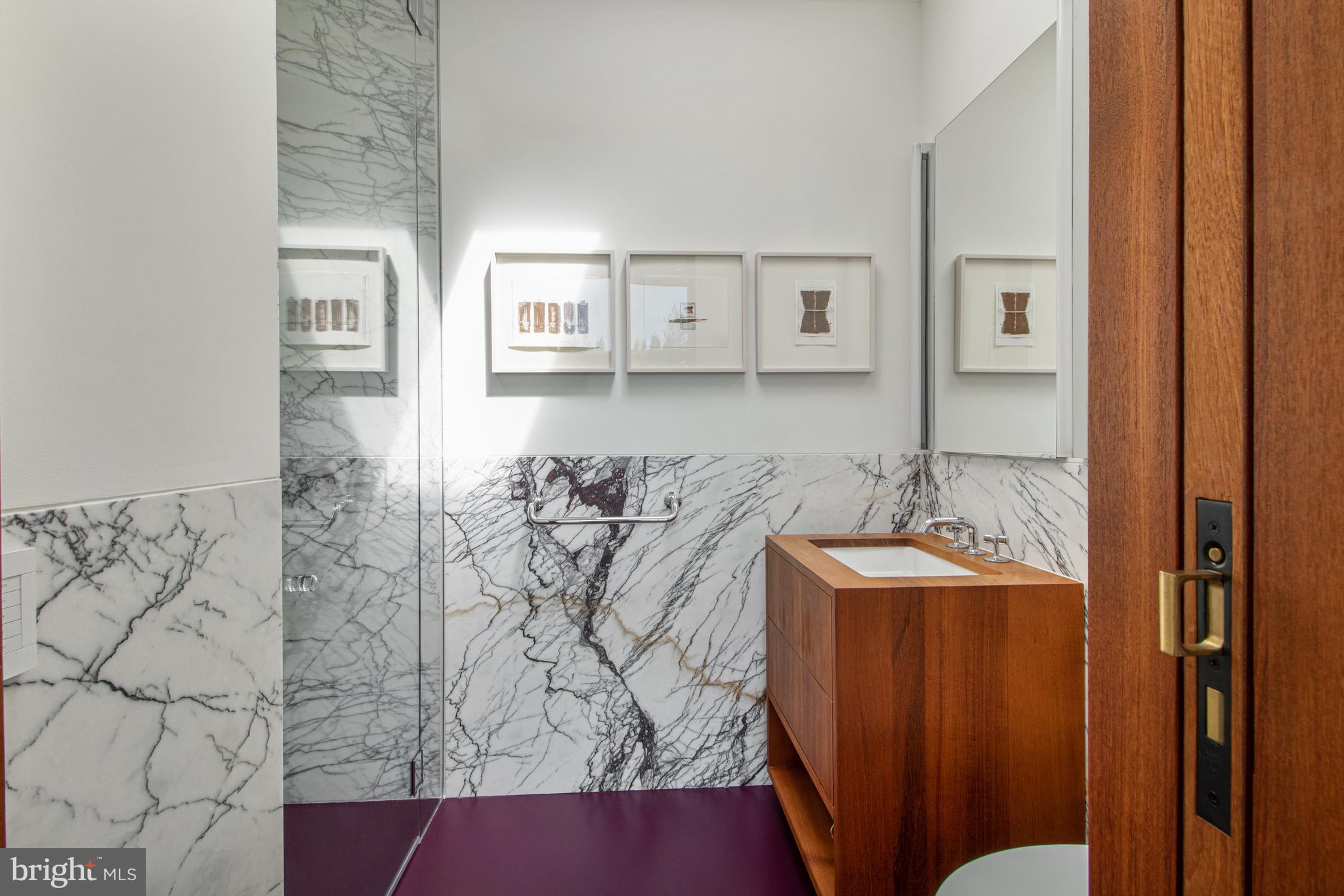 1711 14th Street Northwest, Unit PH Washington, DC 20009 - Photo 29 of 39 a bathroom with a bathtub and shower