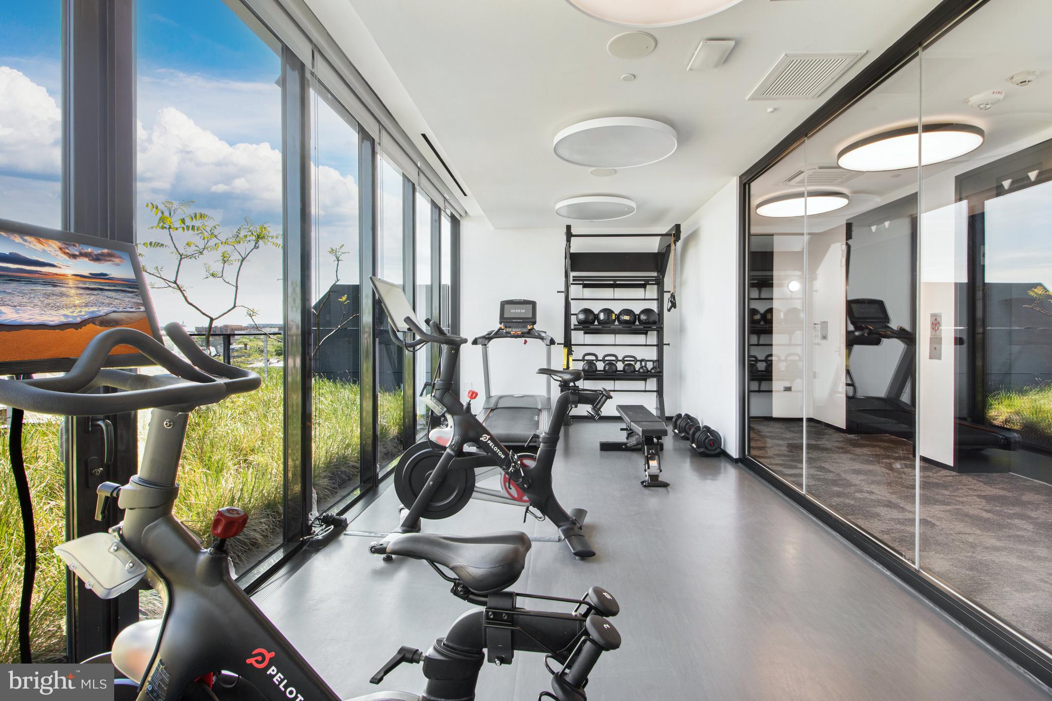 1711 14th Street Northwest, Unit PH Washington, DC 20009 - Photo 33 of 39 a room with lots of gym equipment