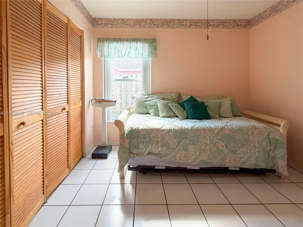 a view of a livingroom with an empty space and a window