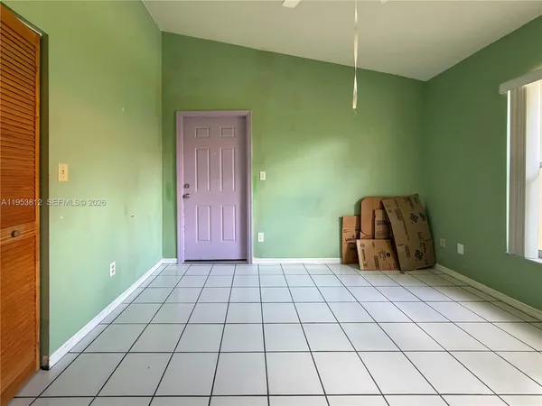 a view of an empty room and window