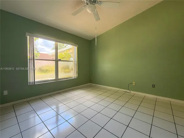 a view of empty room with windows