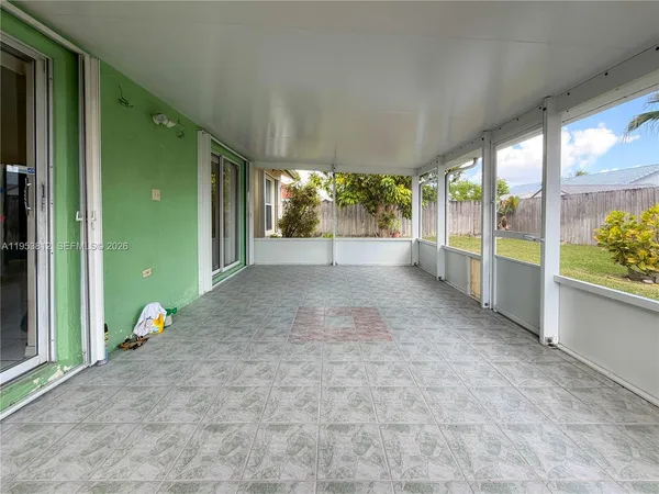 a view of an empty room with a large window