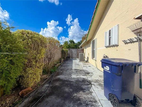 a view of a pathway of a house with wooden floor