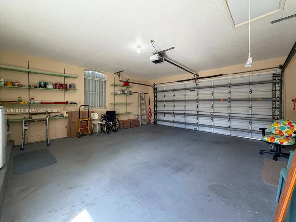 a view of a storage & utility room with two washing machine