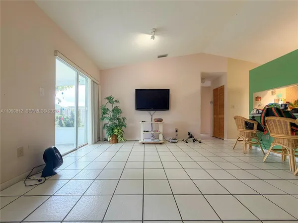 a living room with a couch and a flat screen tv