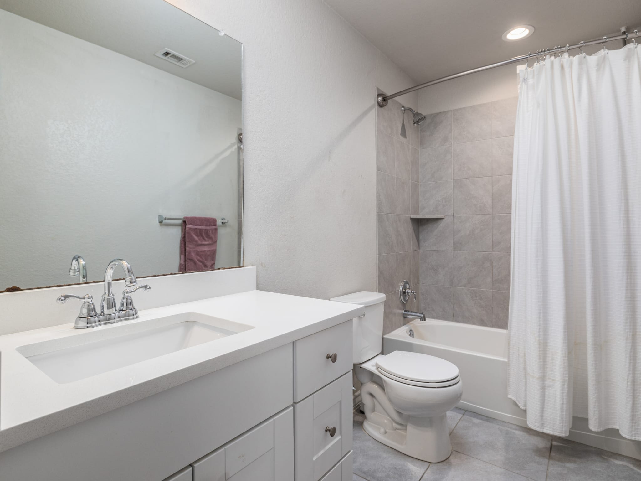 1919 Rinker Ranch Drive Austin, TX 78725 - Photo 16 of 30 Full bathroom with vanity, shower / tub combo, light tile patterned floors, and recessed lighting