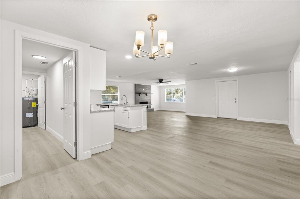 1251 Northwest 23rd Avenue Ocala, FL 34475 - Photo 11 of 34 a view of a kitchen with cabinet and a chandelier