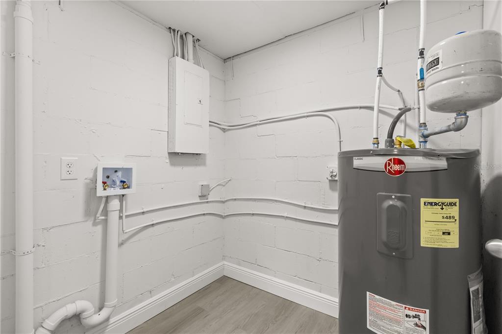 1251 Northwest 23rd Avenue Ocala, FL 34475 - Photo 25 of 34 a view of storage and utility room with washer and dryer