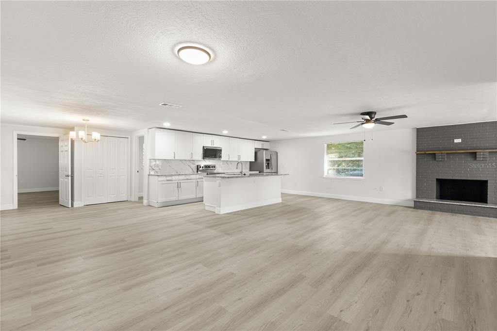 1251 Northwest 23rd Avenue Ocala, FL 34475 - Photo 4 of 34 a view of a kitchen with a sink and a window