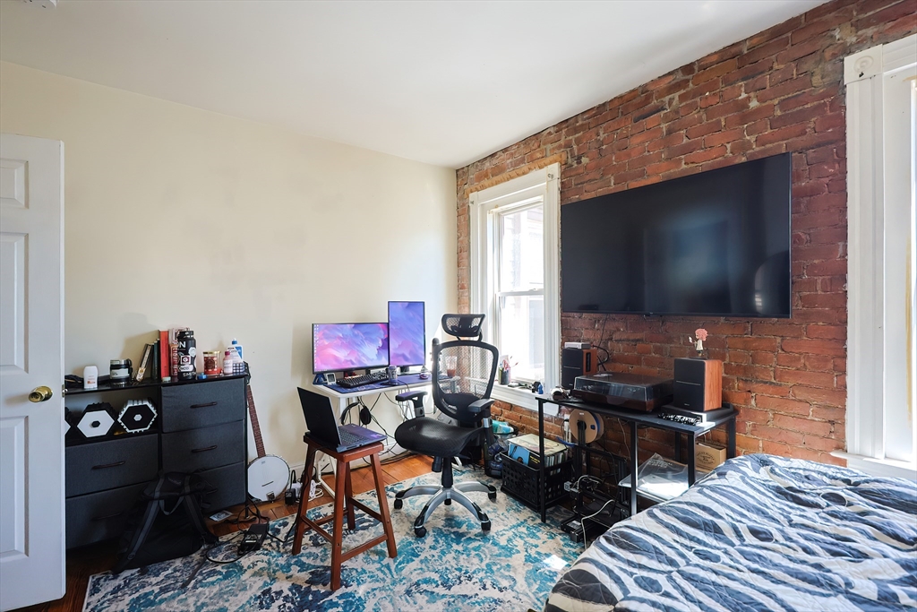 35 Adamson Street Boston, MA 02134 - Photo 11 of 41 a living room with furniture and a flat screen tv