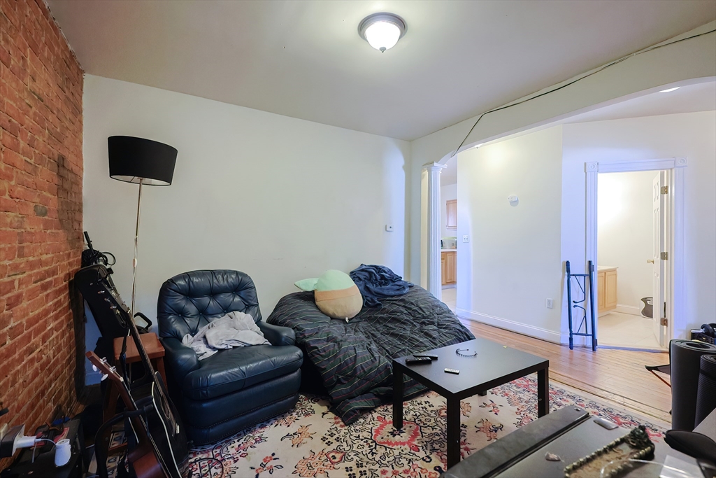35 Adamson Street Boston, MA 02134 - Photo 20 of 41 a living room with furniture and a wooden floor