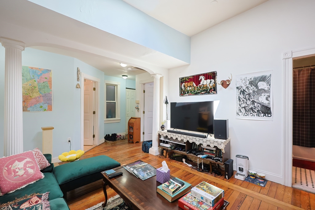 35 Adamson Street Boston, MA 02134 - Photo 32 of 41 a living room with furniture and a flat screen tv