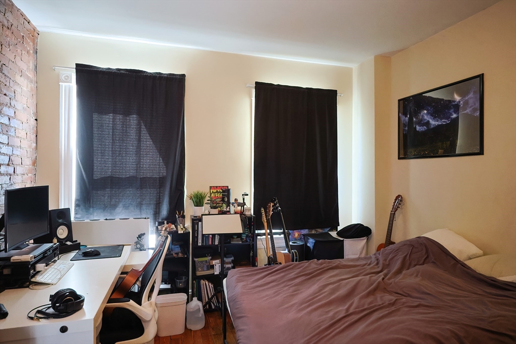 35 Adamson Street Boston, MA 02134 - Photo 6 of 41 a bedroom with a bed and a desk