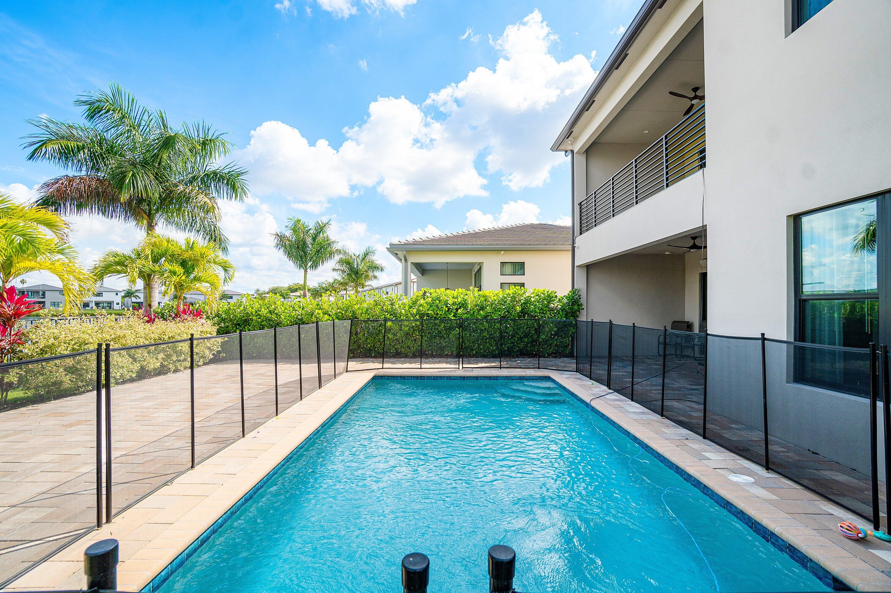 8233 Crystal Downs Avenue Boca Raton, FL 33434 - Photo 54 of 58 a view of a house with a backyard