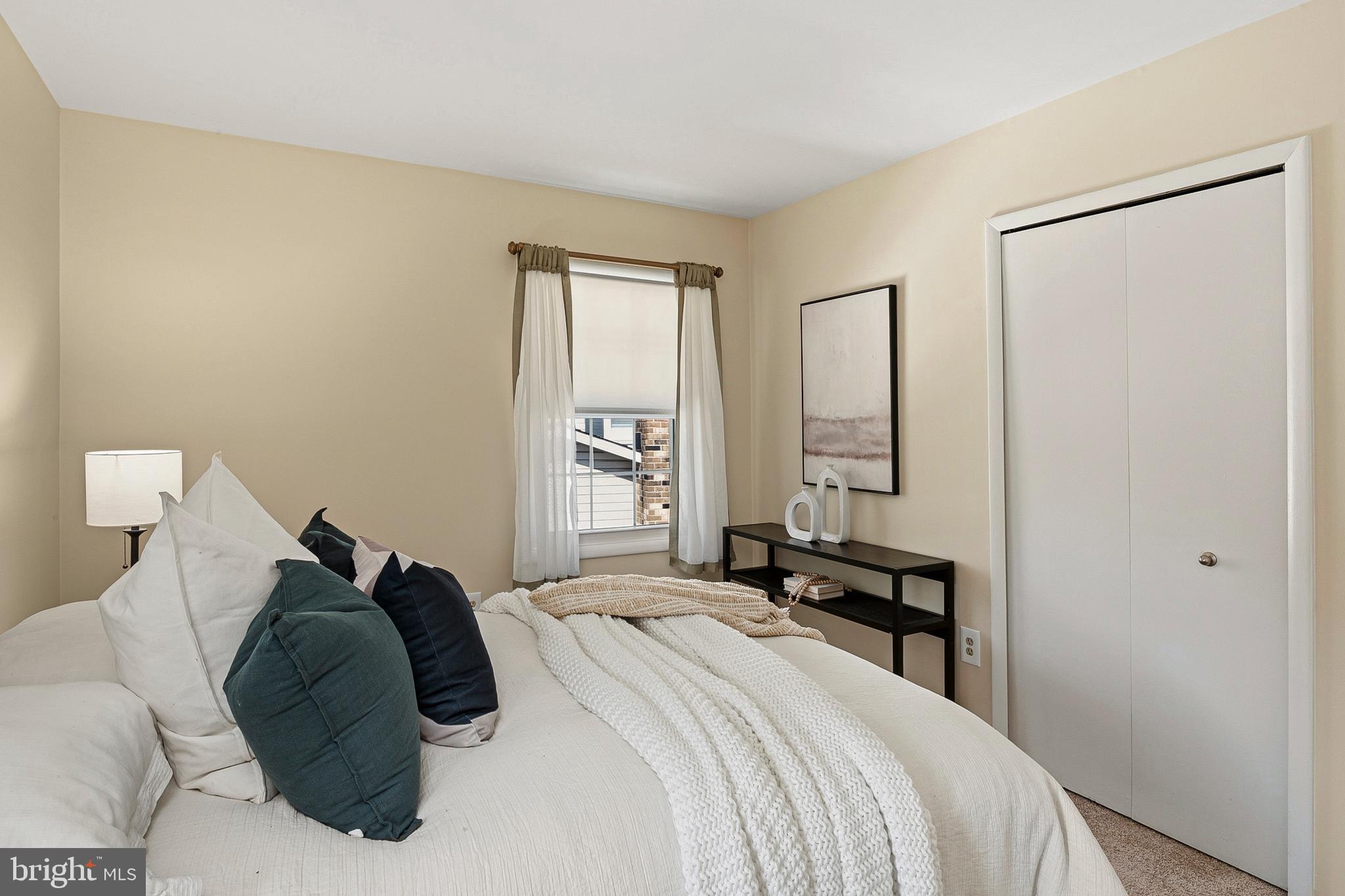 982 Fall Cir Way Gambrills, MD 21054 - Photo 13 of 32 a bedroom with a bed and a window